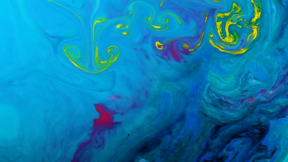 Yellow Psychedelic Dyes Are Mixed in Abstract Patterns in a Blue Liquid alt
