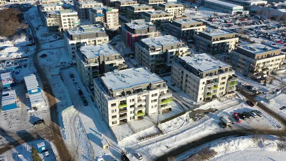 Zlicin, suburbia of Prague, Czech Republic. Aerial view of snow capped buildings in residential neig