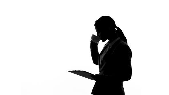 Lady Boss Drinking Coffee, Reading Document Folder, Business Decision Making