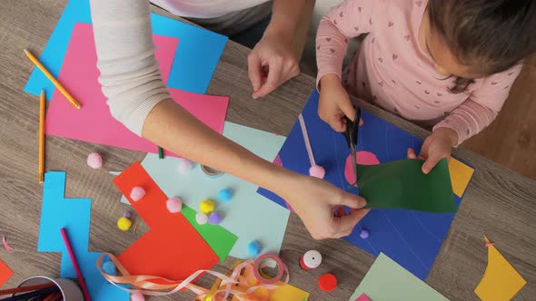 Daughter with Mother Making Applique at Home