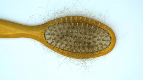 Vertical orientation video: Hairbrush with fallen out hair