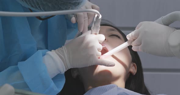 Dentist examines the patient teeth