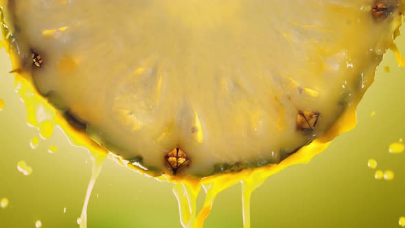 Flowing Pineapple Juice From Pineapple Slice Macro Shot in Slow Motion