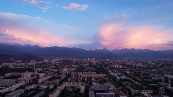 Pinkblue Large Clouds Over the City and Mountains