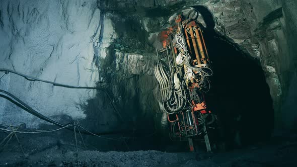 Boring Machine is Drilling Ground in the Mine