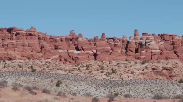 Fiery Red Massive Rock Pinnacles Formation In Arches Park On Sunny Day In Motion