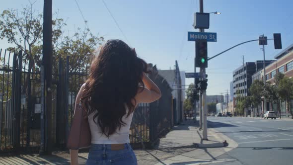 Unrecognizable Woman Crossing Street