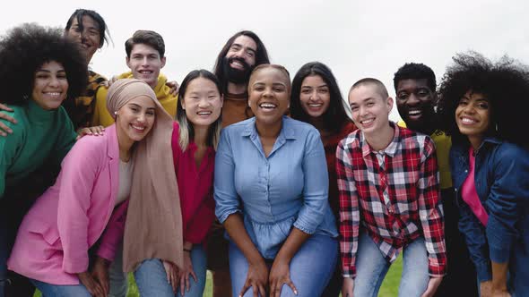 Young multiracial friends having fun together hanging out in the city