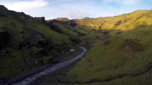 Drone shot of valley with Seljavallalaug hidden swimming pool in Iceland.