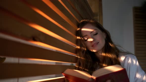 Pretty Girl With Long Hair Reads Book