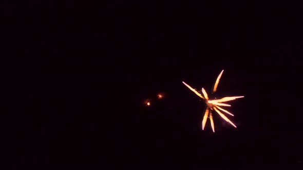 Aerial view of sparkling fireworks display in night sky.