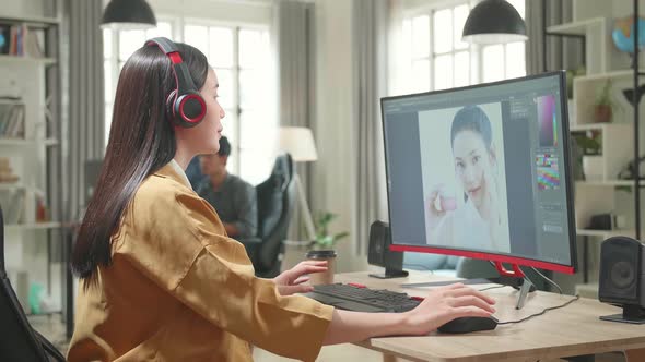 Asian Female Digital Editor Start Works In Photo Editing Software On Her Personal Computer In Office