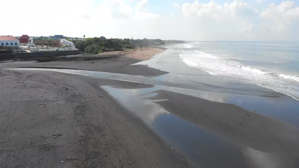 Aerial View Trash On The Black Sand Beach