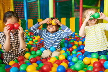 l pit and enjoying time in childrens entertainment and play area, copy space