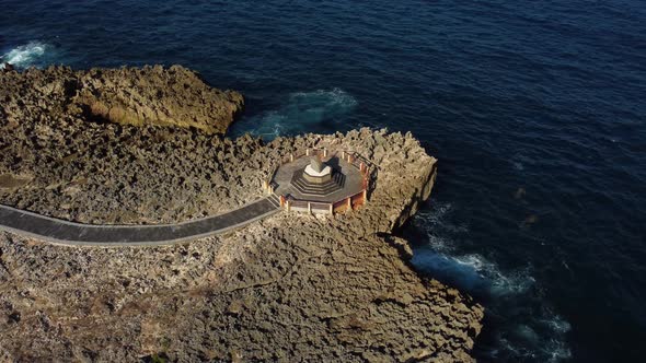 Fly Around Sanctuary on the Cliff Over Ocean