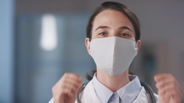 Doctor Taking Off Mask