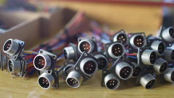 Slider Shot Video of Blurry Metal Sockets for Plugs