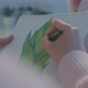 Female Designer Designer Drawing Picture in a Sketchbook - VideoHive Item for Sale