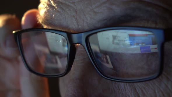 Closeup of the Focused Eyes of a Businessman Wearing Computer Glasses