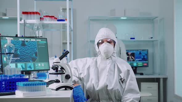 Exhausted Chemist Looking at Camera Wearing Coverall