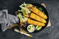 Roasted or grilled sweet corn cobs with garlic butter and lime. - PhotoDune Item for Sale