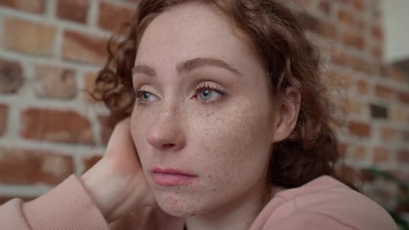 Close up of sad young caucasian woman. Shot with RED helium camera in 8K.