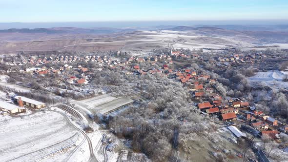 Aerial Shot of a Village Covered by Snow in the Winter