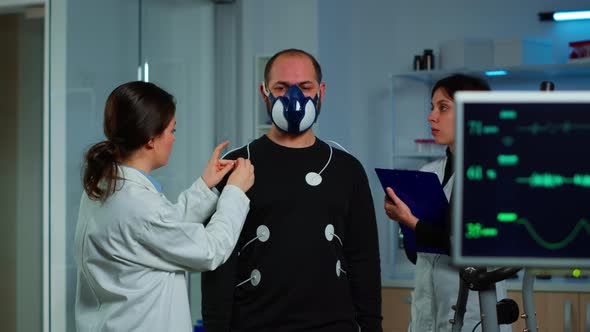 Woman Researcher Preparing Patient for Endurance Test