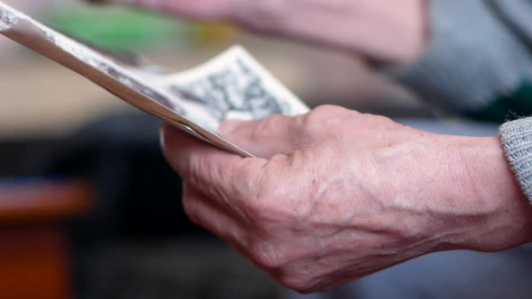 Memories of an elderly man looking at old photographs.