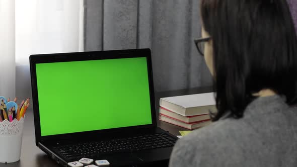 Woman Teacher Making Online Distance Education Video Call on Laptop Green Screen