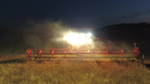 Combine Harvester at Night During the Harvest