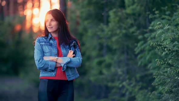 Beautiful Girl Posing in the Park at Sunset