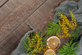 Old wooden table with mimosa flowers and leaves. Background imag - PhotoDune Item for Sale