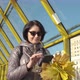 A Middleaged Woman Brunette Caucasian with Short Hair with a Bouquet of Yellow Leaves Walks Along - VideoHive Item for Sale