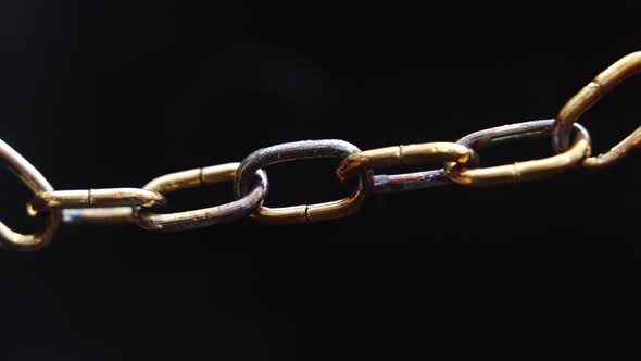 Weakest Link - Concept -  Chain slowly heats up and starts to sparkle, then brakes.