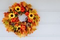 Autumn wreath with sunflowers, pumpkins and maple leaves on wooden door - PhotoDune Item for Sale