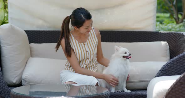 Woman go resort hotel with her dog
