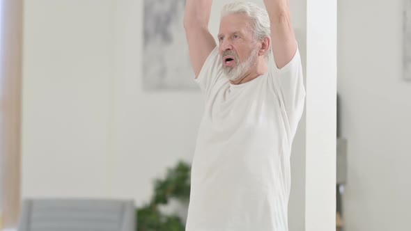 Close Up of Old Man Doing Stretches on Yoga Mat