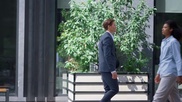 Bank Manager Going for Walk on Lunch Break in Modern Downtown City Street