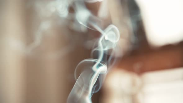 Close Up Shot of an Aromatic Stick Burning with Beautiful White Smoke.