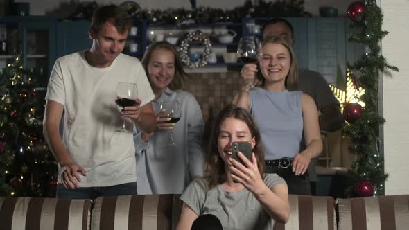 group young people congratulate friends on Christmas and new year video link.