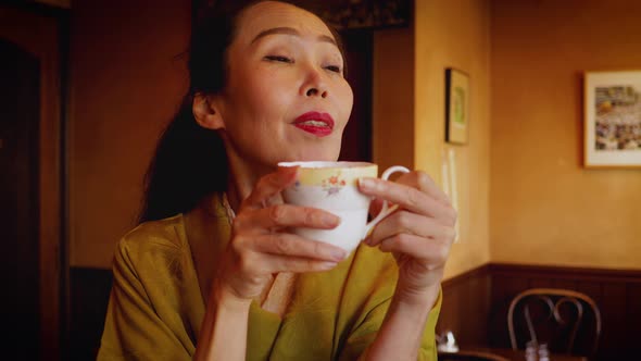 Elegant Japanese woman enjoying a coffee