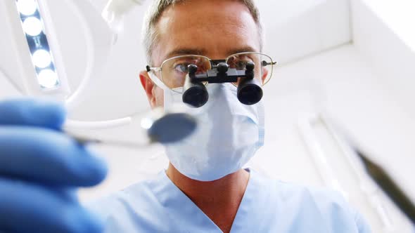 Dentist holding dental tool