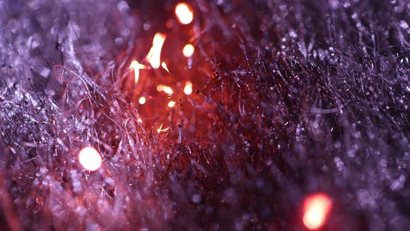 Macro of steel wool burning as fire moves through fibers.