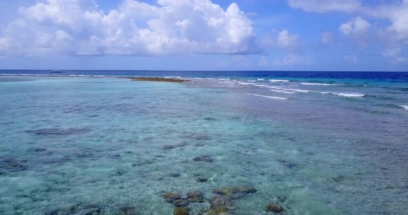 Luxury drone copy space shot of a white sandy paradise beach and blue sea background 