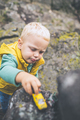 Toddler boy playing on a rock - PhotoDune Item for Sale