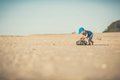 Toddler boy playing on a sunny beach - PhotoDune Item for Sale