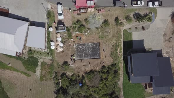 Aerial descends to frame new home foundation under construction