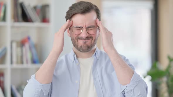 Portrait of Man in Glasses Having Headache