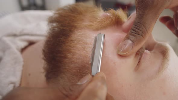 Berber Styling Beard of Client with Straight Razor